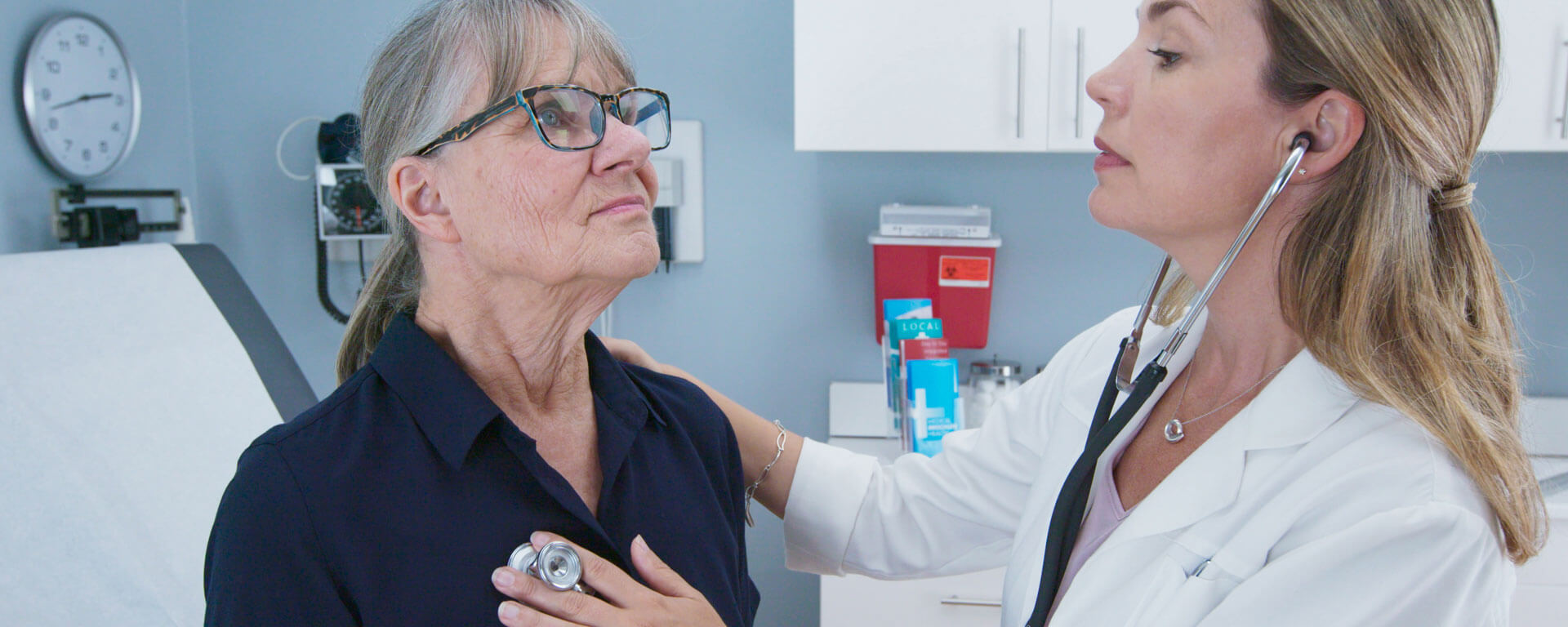 Doctor Listening To Patients Heart